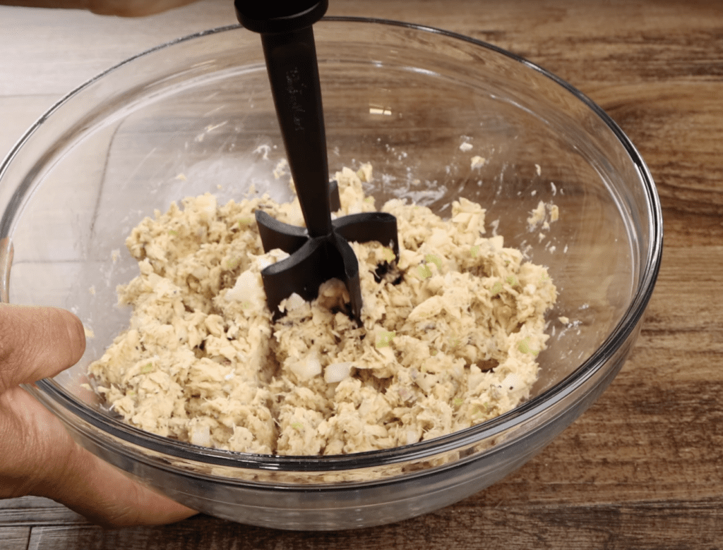 mixing the ingredients for the salmon patties